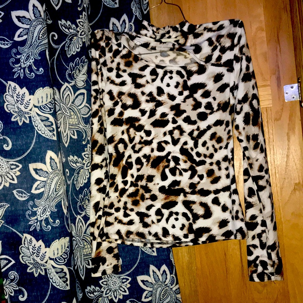 Woman’s cheetah print turtle neck long sleeve shirt